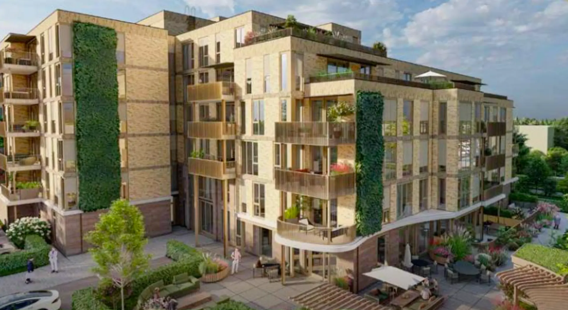 Vooraanzicht van het appartementencomplex in Zwijndrecht met groene gevels en balkons